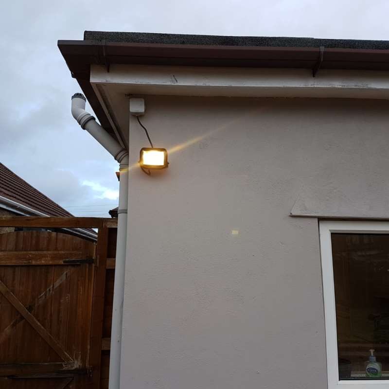 Exterior wall light fitted beside a doorway